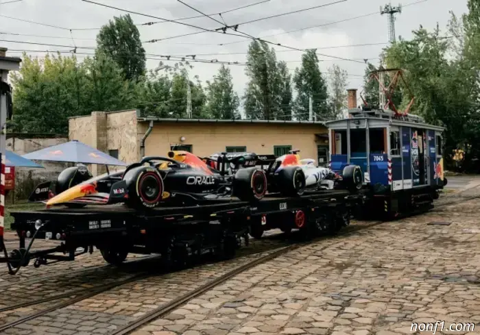 Red Bull cars are being taken around Budapest… by tram.