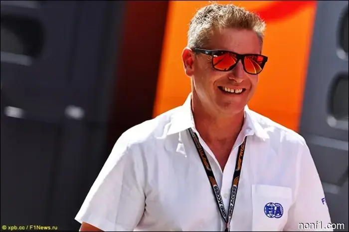 Bernd Maylander gives advice to Max Verstappen.