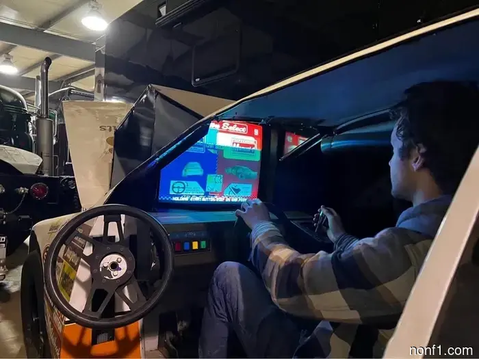 Nothing is cooler than a ’90s NASCAR simulation setup playing Daytona USA.