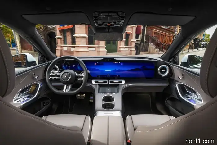The full dashboard display of the Mercedes C-Class electric vehicle boasts an elegance that is reminiscent of a Dave & Buster's.