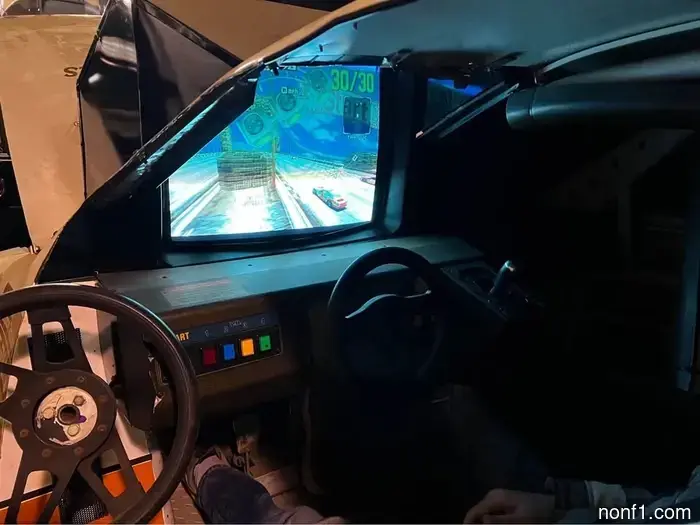 Nothing is cooler than a ’90s NASCAR simulation setup playing Daytona USA.