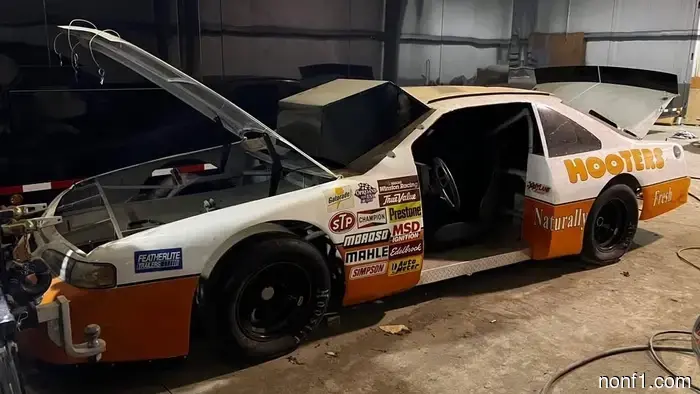 Nothing is cooler than a ’90s NASCAR simulation setup playing Daytona USA.